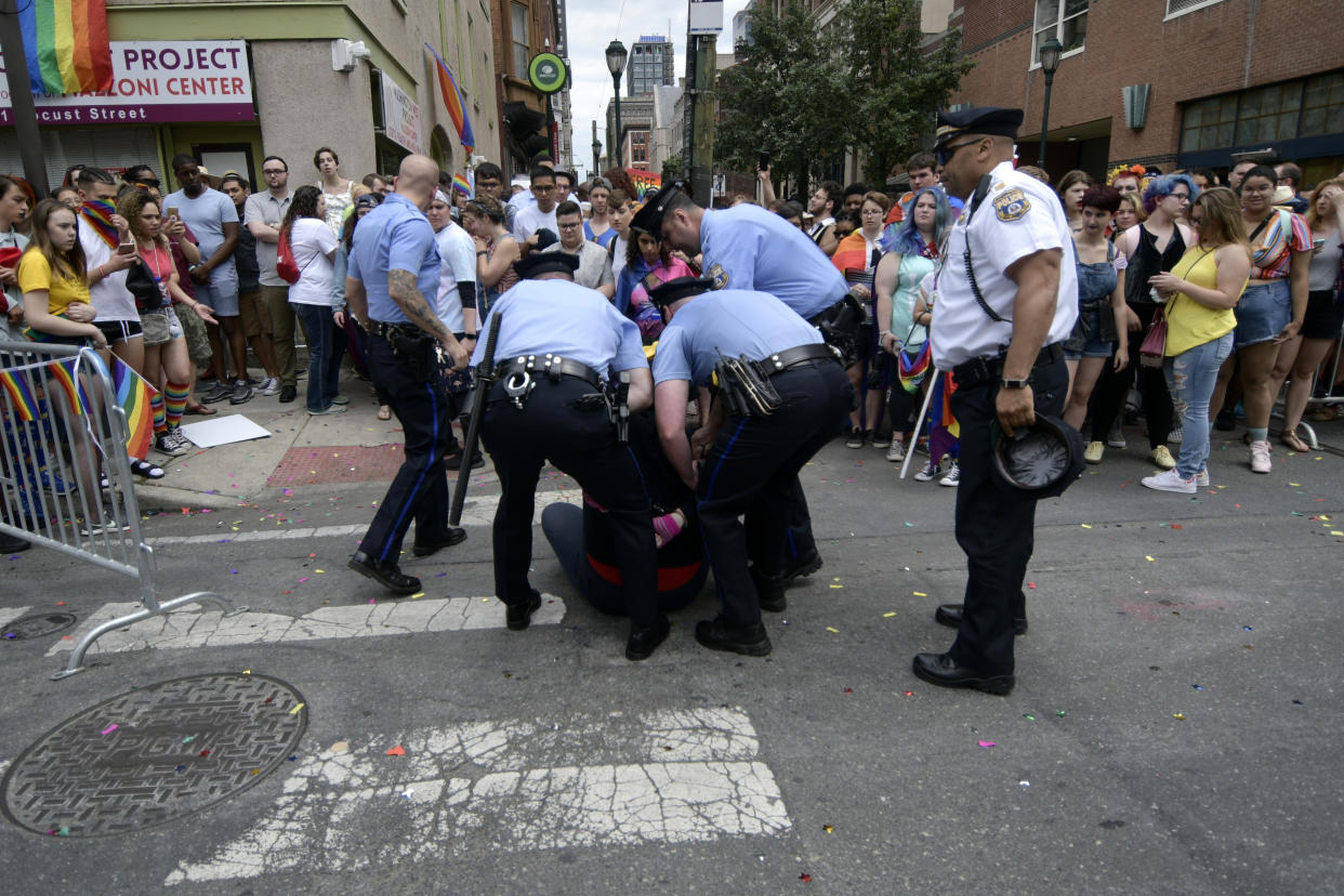 Police officers arrest a female, later identified as Ryan Segin, 18, after she attempted to lit a Blue Lives Matter flag in protest, ahead of the Pride Parade, in Philadelphia, PA, on June 10, 2018.  (Photo by Bastiaan Slabbers/NurPhoto via Getty Images)