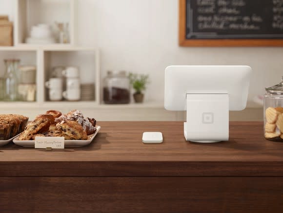 Payment terminal on countertop in a bakery.