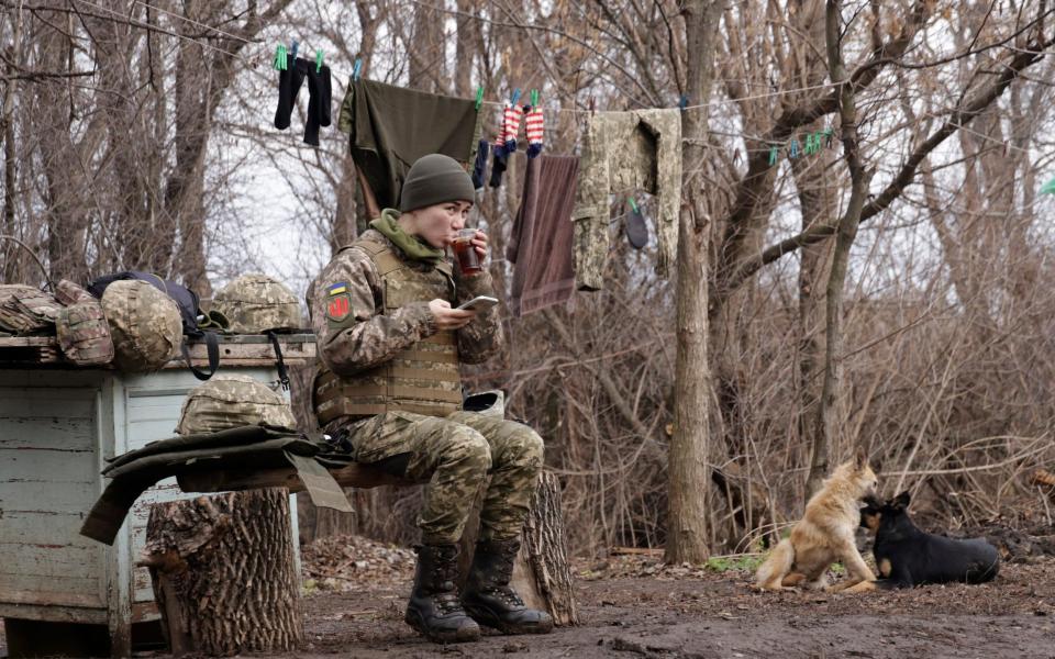  A Ukrainian female soldier take a rest near a fighting position on the line of separation from pro-Russian rebels near Debaltsevo, Donetsk region, Ukraine, Ukraine Friday, Dec 3, 2021 - AP