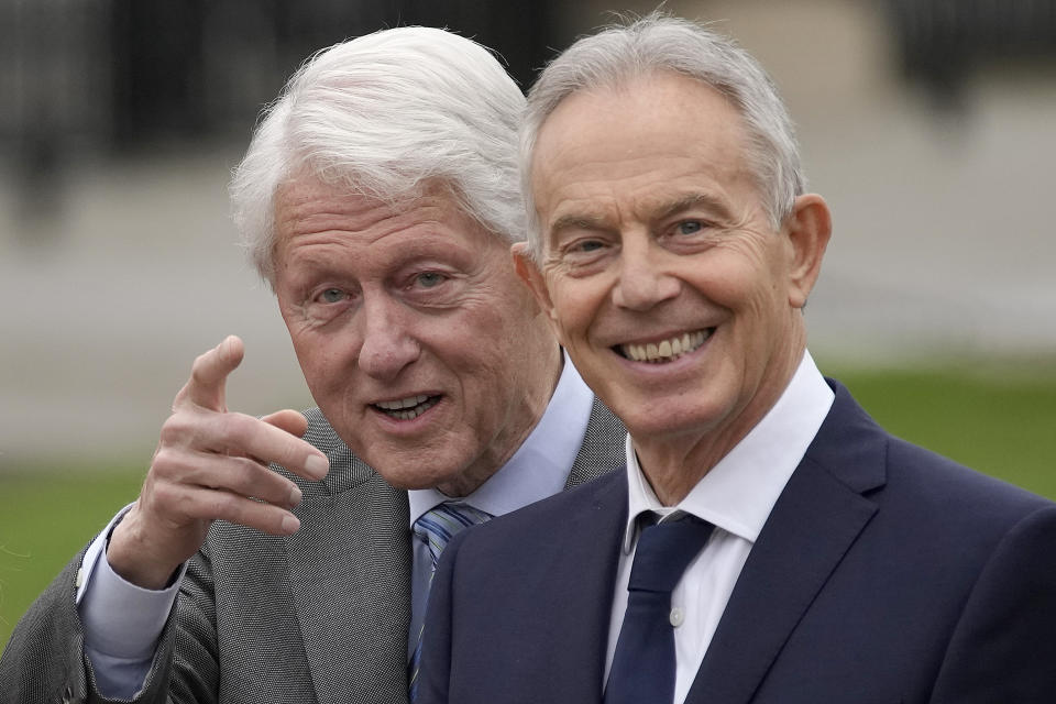 Former US President Bill Clinton, left, stands beside Britain's former Prime Minister Tony Blair during a bust unveiling on the first day of a three-day international conference at Queen's University Belfast to mark the 25th anniversary of the Good Friday Agreement, in Belfast, Northern Ireland, Monday, April 17, 2023. Former U.S. President Bill Clinton and past leaders of the U.K. and Ireland are gathering in Belfast on Monday, 25 years after their charm, clout and determination helped Northern Ireland strike a historic peace accord. (AP Photo/Christophe Ena)