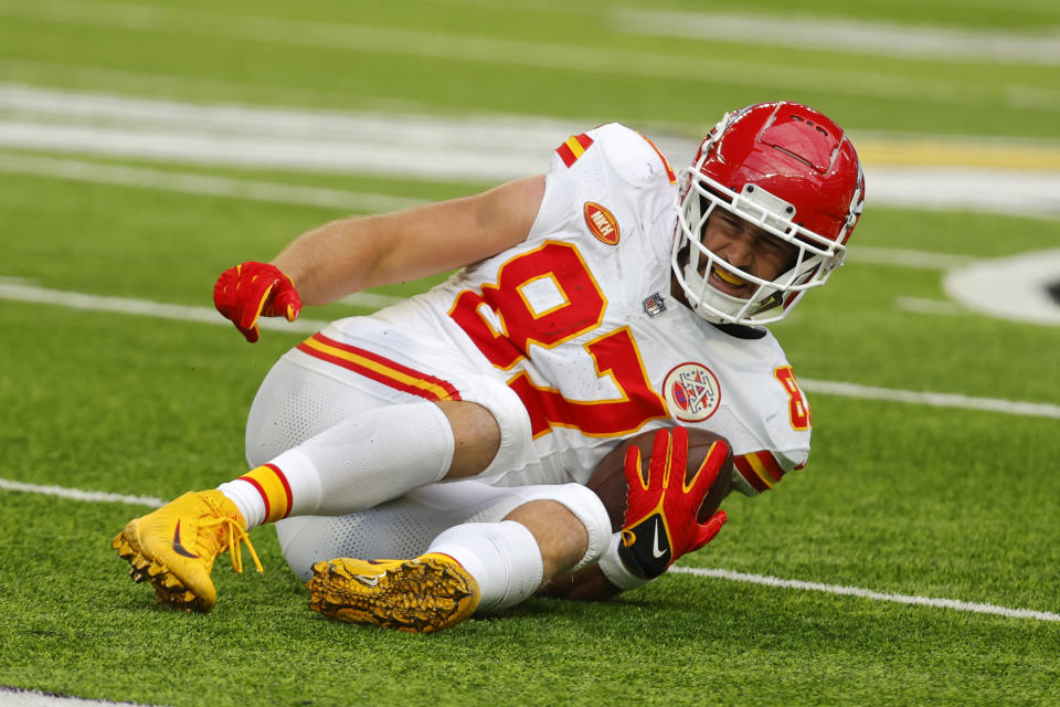 Kansas City Chiefs tight end Travis Kelce (87) reacts after getting injured during the first half of an NFL football game against the Minnesota Vikings, Sunday, Oct. 8, 2023, in Minneapolis. (AP Photo/Bruce Kluckhohn)