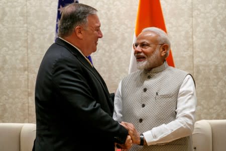 Secretary of State Mike Pompeo shakes hands with Indian PM Modi, during meeting at Prime Minister's Residencein New Delhi