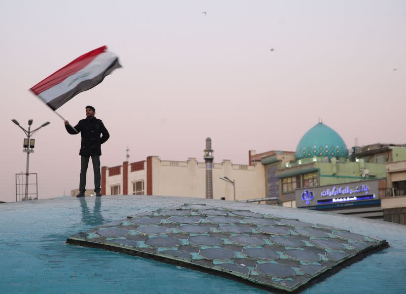 A man celebrates after Iran launched missiles at U.S.-led forces in Iraq, in Tehran