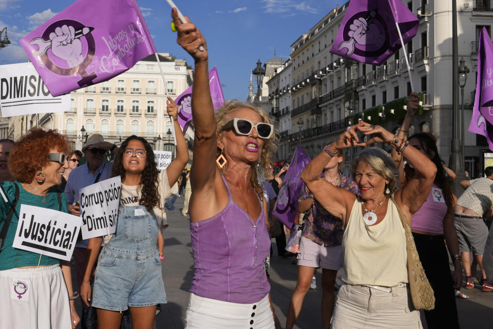 People shout slogans during a protest against the Spanish soccer federation president Luis Rubiales in Madrid, Spain, Friday, Sept. 1, 2023. A Spanish government legal panel is opening a case against suspended soccer chief Luis Rubiales who has come in for a storm of criticism and calls for his resignation for kissing a player on the lips without consent after Spain won the recent Women's World Cup final in Sydney. Placards read 'Justice', Corruption, Resign'. (AP Photo/Paul White)