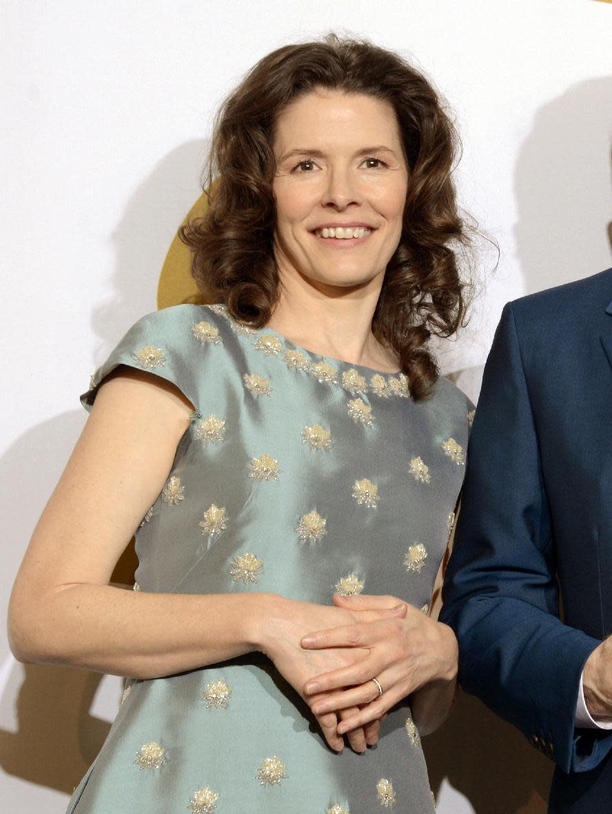 FILE - This Jan. 26, 2014 file photo shows Edie Brickell in the press room after winning the award with Steve Martin for best American roots song, "Love Has Come For You," at the 56th annual Grammy Awards in Los Angeles. Police in Connecticut say Paul Simon and his wife, singer Edie Brickell, have been arrested on disorderly conduct charges. A New Canaan police spokeswoman provided no other details, except to say the arrests stemmed from an incident Saturday. An arraignment in Norwalk Superior Court is expected Monday afternoon. Simon is a 12-time Grammy winner and a member of The Songwriters Hall of Fame and the Rock n' Roll Hall of Fame — as half of the duo of Simon and Garfunkel and as a solo artist. Brickell's "What I Am," recorded with her band the New Bohemians, was a hit in 1988. The two were married in 1992. (Photo by Dan Steinberg/Invision/AP, File)