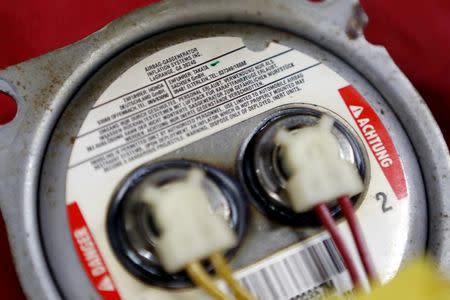 A recalled Takata airbag inflator is shown after it was removed at the AutoNation Honda dealership service department in Miami, Florida, United States on June 25, 2015. REUTERS/Joe Skipper/File Photo