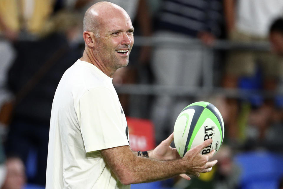 South Africa's head coach Jacques Nienaber catches a ball as his team warms up ahead of their Rugby Championship match against Australia on Sunday, Sept. 12, 2021, Gold Coast, Australia. (AP Photo/Tertius Pickard)