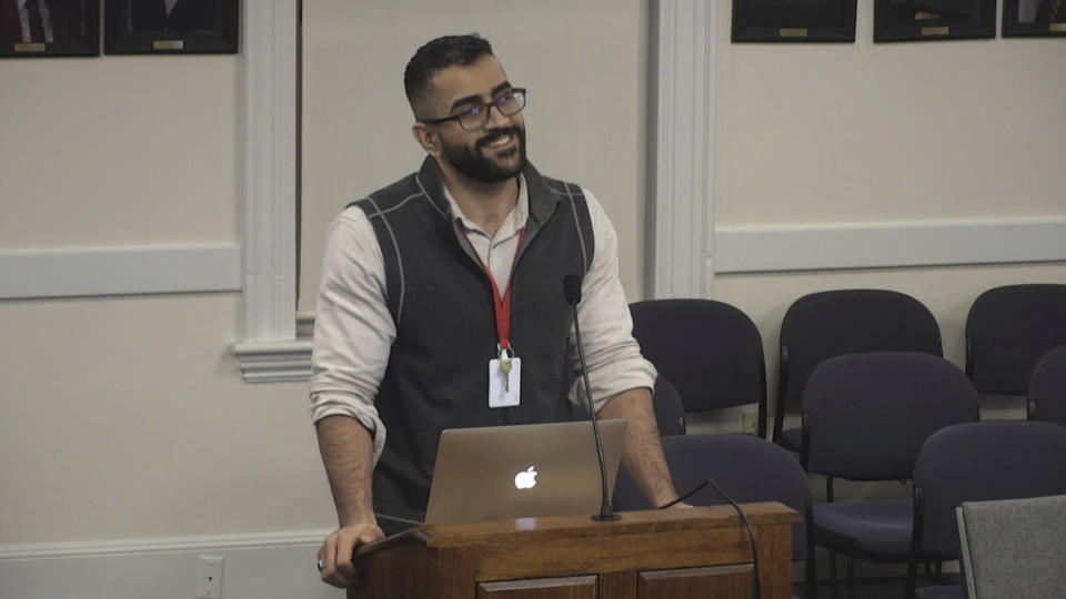 This undated image made from video provided by South Portland Community Television shows Mohammed Albehadli during a meeting in South Portland, Maine. Albehadli resigned as the diversity, equity and inclusion director in South Portland schools after a receiving a hateful, threatening email from a white supremacist. (South Portland Community Television via AP)