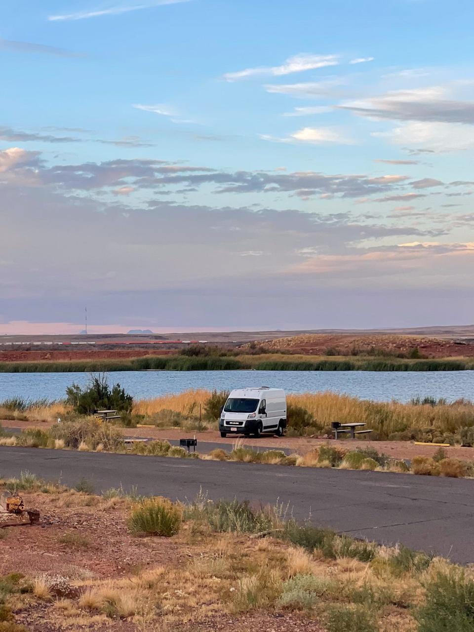 The author's van parked next to a lake.