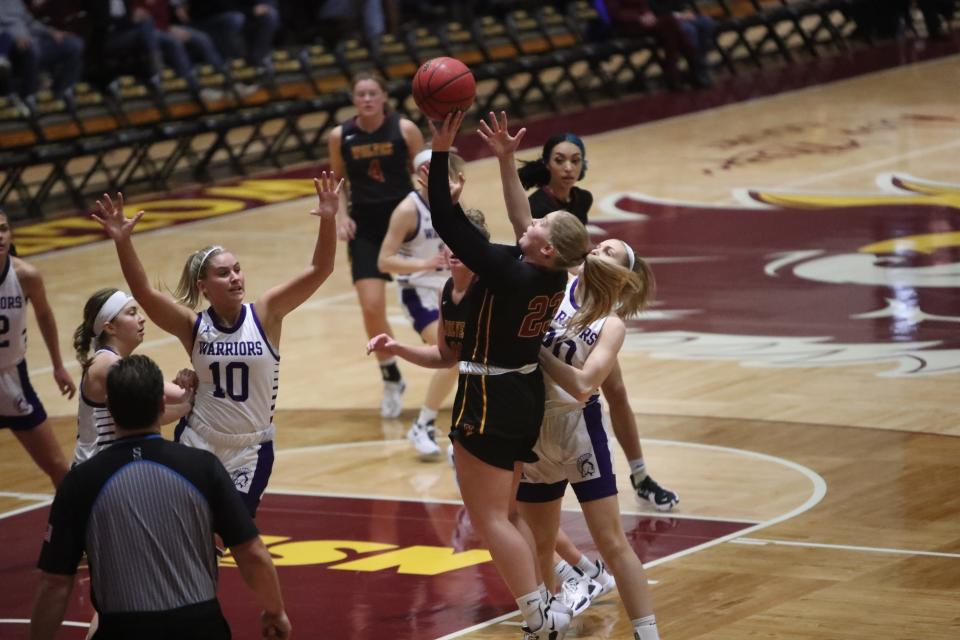 Northern State's Haley Johnson puts a shot up over a host of Winona State defenders. Johnson finished with a career-high 17 points.