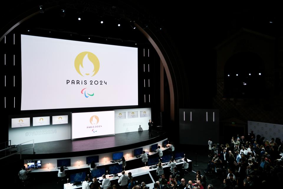 People attend a logo presentation ceremony for Paris 2024 Olympic Games at the Grand Rex cinema in Paris on October 21, 2019. (Photo by STEPHANE DE SAKUTIN / AFP) (Photo by STEPHANE DE SAKUTIN/AFP via Getty Images)