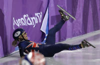 <p>Elise Christie of Britain crashes during the ladies’ 500 meters short track speedskating final in the Gangneung Ice Arena at the 2018 Winter Olympics in Gangneung, South Korea, Tuesday, Feb. 13, 2018. (AP Photo/David J. Phillip) </p>