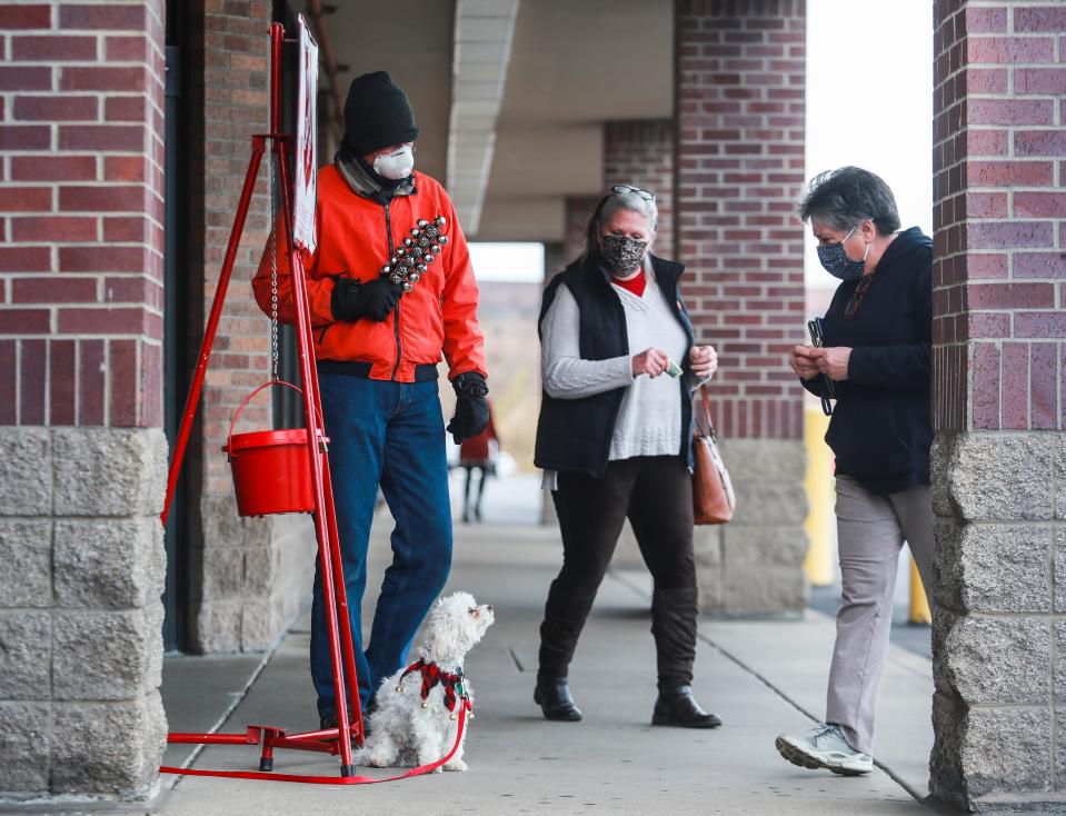 "I don't know what I would have done if we couldn't ring because it's very fundamental to me and Christmas," Bill Kolodey said. "It's Christmas for me." Kolodey brought his dog Doodle as he shakes bells for the Salvation Army during a Christmas donation drive outside the Hobby Lobby store in St. Matthews recently.