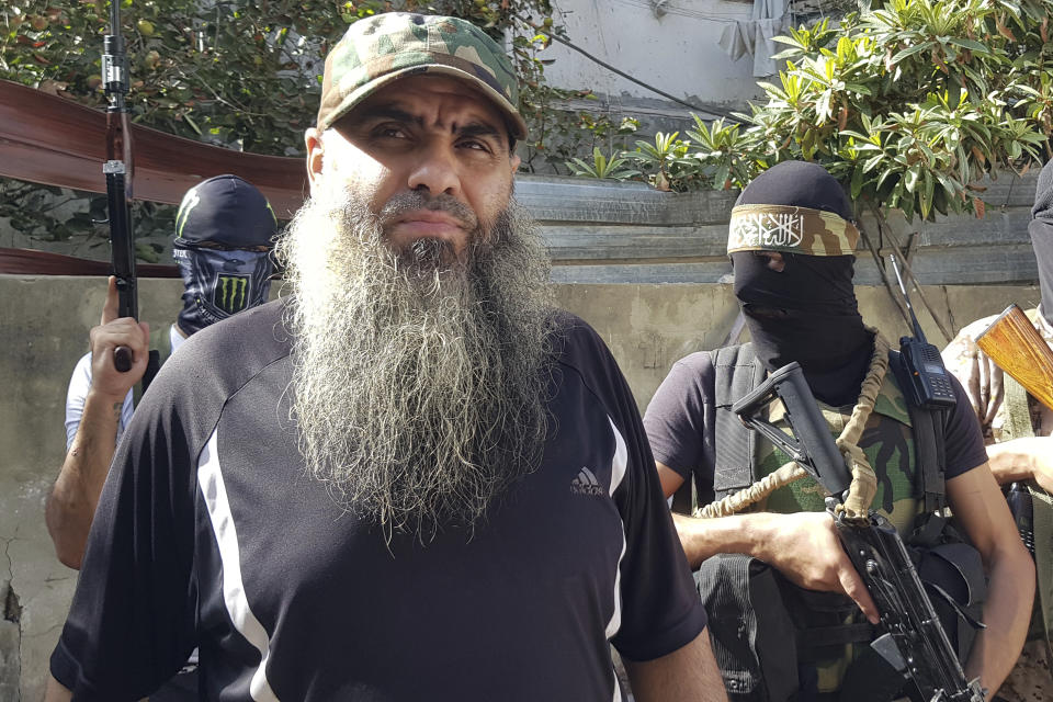 Commander of Shabab al Muslim, Haitham al-Shaabi, stands in the Palestinian refugee camp of Ein el-Hilweh near the southern port city of Sidon, Lebanon, Friday, Sept. 29, 2023. A Palestinian security force deployed Friday in a school complex in Lebanon's largest Palestinian refugee camp in the country's south, replacing gunmen who had occupied it since fighting broke out in late July leaving more than 30 people dead. (AP Photo/Mohammed Zaatari)