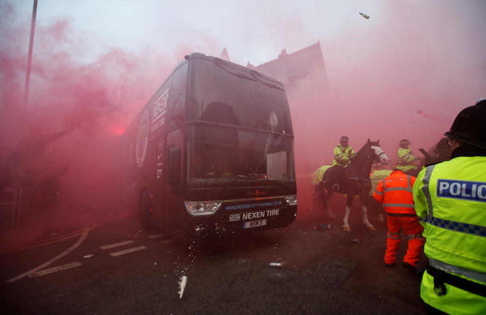 <p>Soccer Football – Champions League Quarter Final First Leg – Liverpool vs Manchester City – Anfield, Liverpool, Britain – April 4, 2018 Liverpool fans set off flares and throw missiles at the Manchester City team bus outside the stadium before the match Action Images via Reuters/Carl Recine </p>