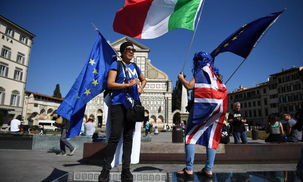 Protesters gather before Theresa May’s Brexit speech in Florence, Italy.