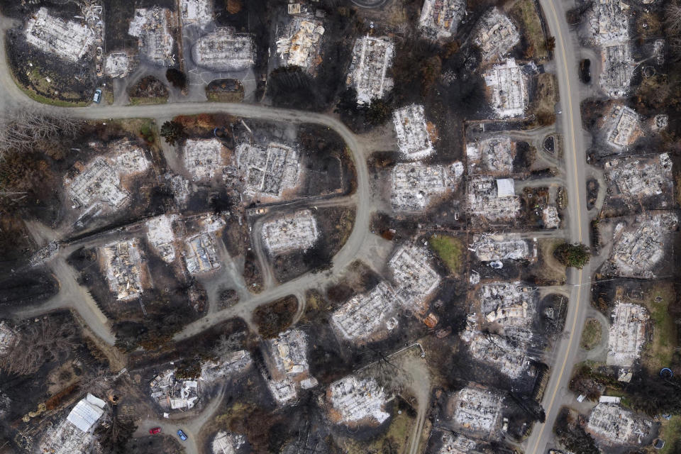 In this aerial photo provided by Matt Brandt Photography, are homes burned by wildfire near Pony Trail Lane in Otis, Ore., on Sept. 21, 2020. Oregon's unprecedented wildfire season last fall burned 4,000 homes and more than 1 million acres in areas that aren't normally associated with wildfire. Experts say the 2020 wildfire season in Oregon was a taste of what lies ahead as climate change makes blazes more likely and more destructive even in wetter, cooler climates like the Pacific Northwest. (Matt Brandt Photography via AP)