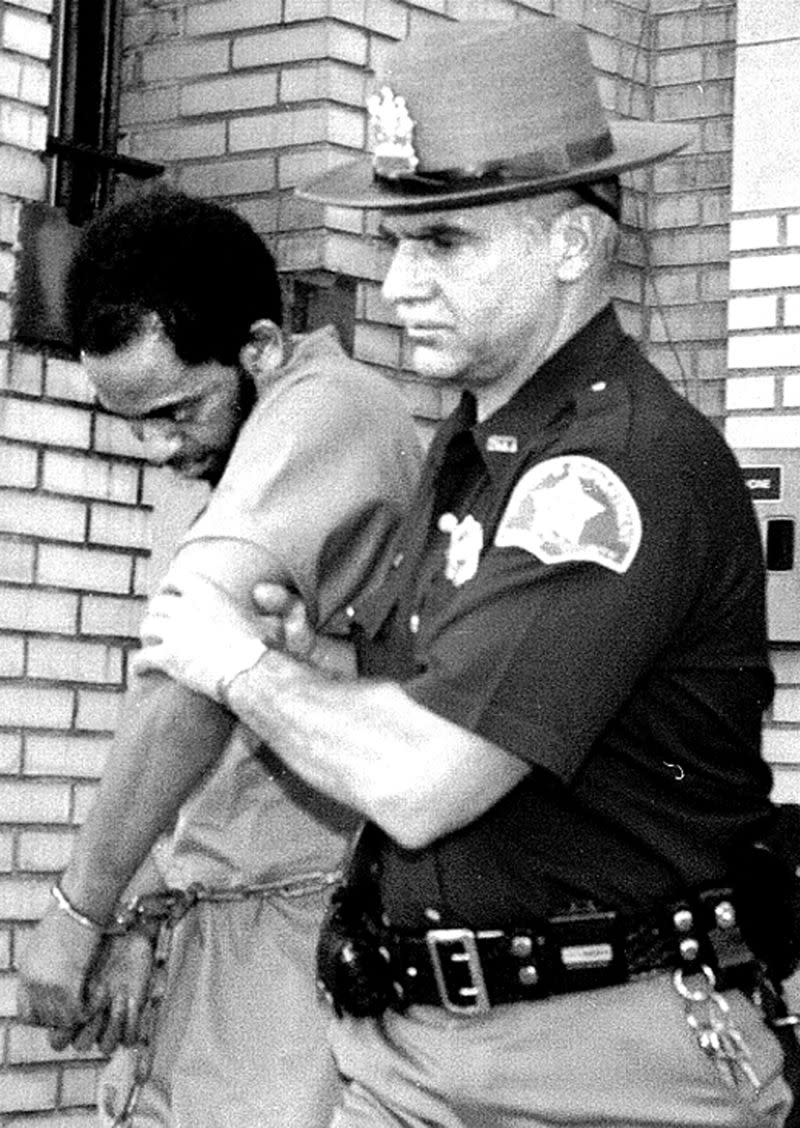 Joseph Harris being escorted by a police officer. Source: Dan Farrell/ Daily News