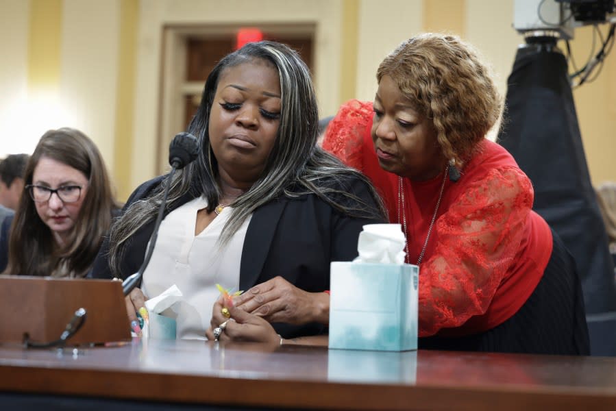 Wandrea ArShaye “Shaye” Moss (left), former Georgia election worker, is comforted by her mother Ruby Freeman (right) as Moss testifies during the fourth hearing on the January 6th investigation in the Cannon House Office Building on June 21, 2022, in Washington, D.C. (Photo by Kevin Dietsch/Getty Images)