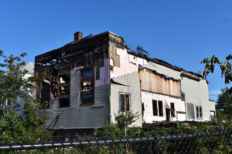 The shell of the building at 277 Brightman St. remains Wednesday after a massive fire Tuesday evening that caused heavy smoke in the neighborhood and resulted in the roof collapsing on the building.