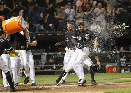 Aug 10, 2018; Chicago, IL, USA; Chicago White Sox right fielder Daniel Palka (18) is splashed with Gatarade as he crosses home plate after hitting game winning home run against the Cleveland Indians at Guaranteed Rate Field. Mandatory Credit: Kamil Krzaczynski-USA TODAY Sports