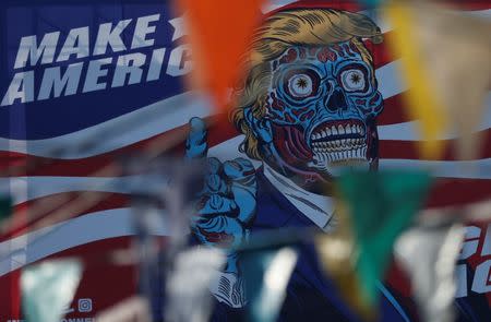 A giant billboard shows a drawing depicting U.S. President Donald Trump, along Periferico avenue in Mexico City, Mexico, July 28, 2017. REUTERS/Henry Romero