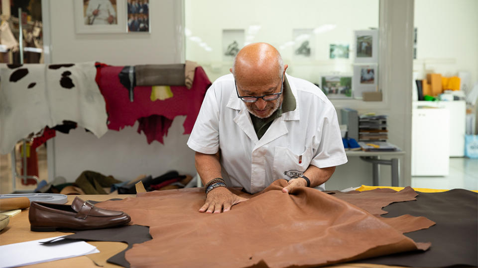 Leather master Tony Ripani inspects a hide