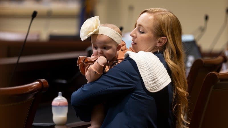 Rep. Candice Pierucci, R-Herriman, sits with her daughter Quincy after presenting SB230 at the Capitol in Salt Lake City on Monday, Feb. 26, 2024.