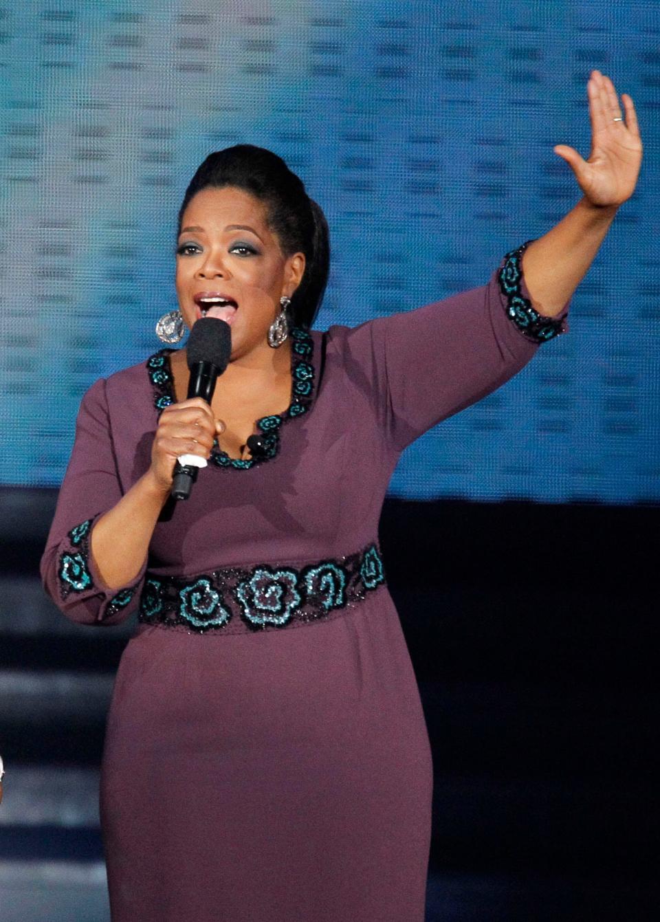 In this May 17, 2011 file photo, Oprah Winfrey acknowledges fans during a star-studded double-taping of "Surprise Oprah! A Farewell Spectacular, in Chicago.