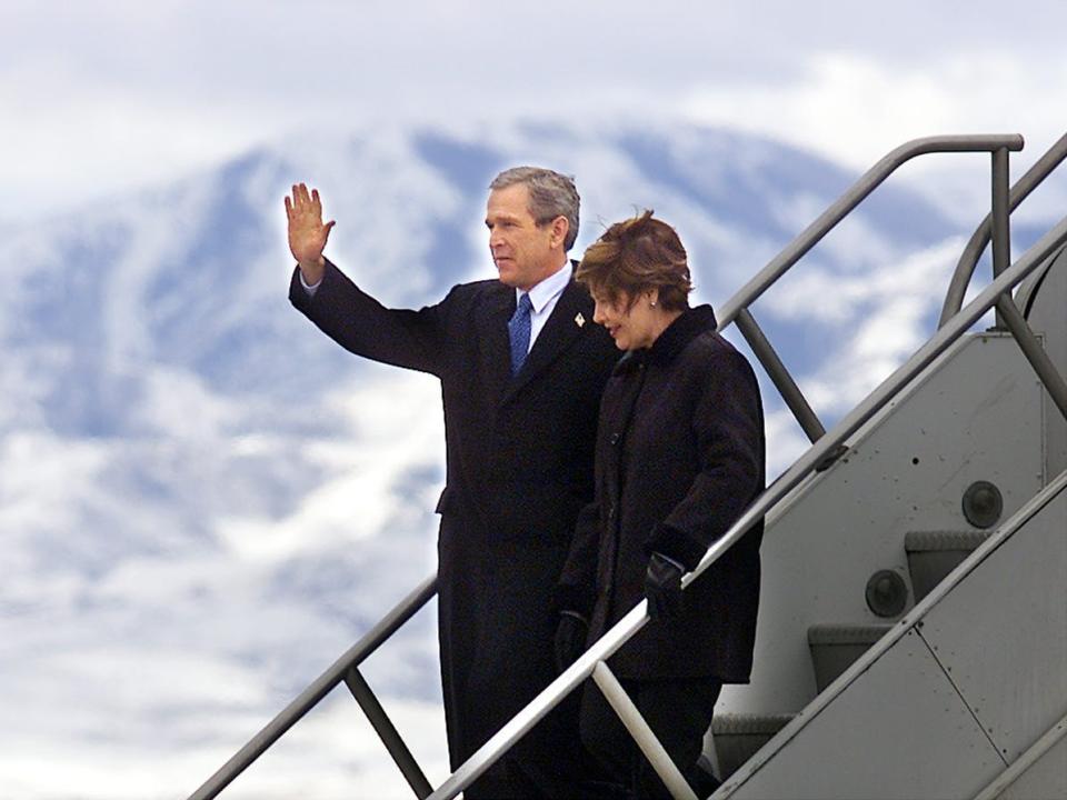 President Bush, with first lady Laura Bush, steps down from Air Force One in Salt Lake City, Utah, to participate in the opening ceremonies of the 2002 Winter Olympic Games, Friday, Feb. 8, 2002.