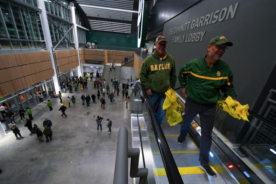 Spectators arrive for the first event at Foster Pavilion, an NCAA college basketball game between Baylor and Cornell, Tuesday, Jan. 2, 2024, in Waco, Texas. (AP Photo/Julio Cortez)
