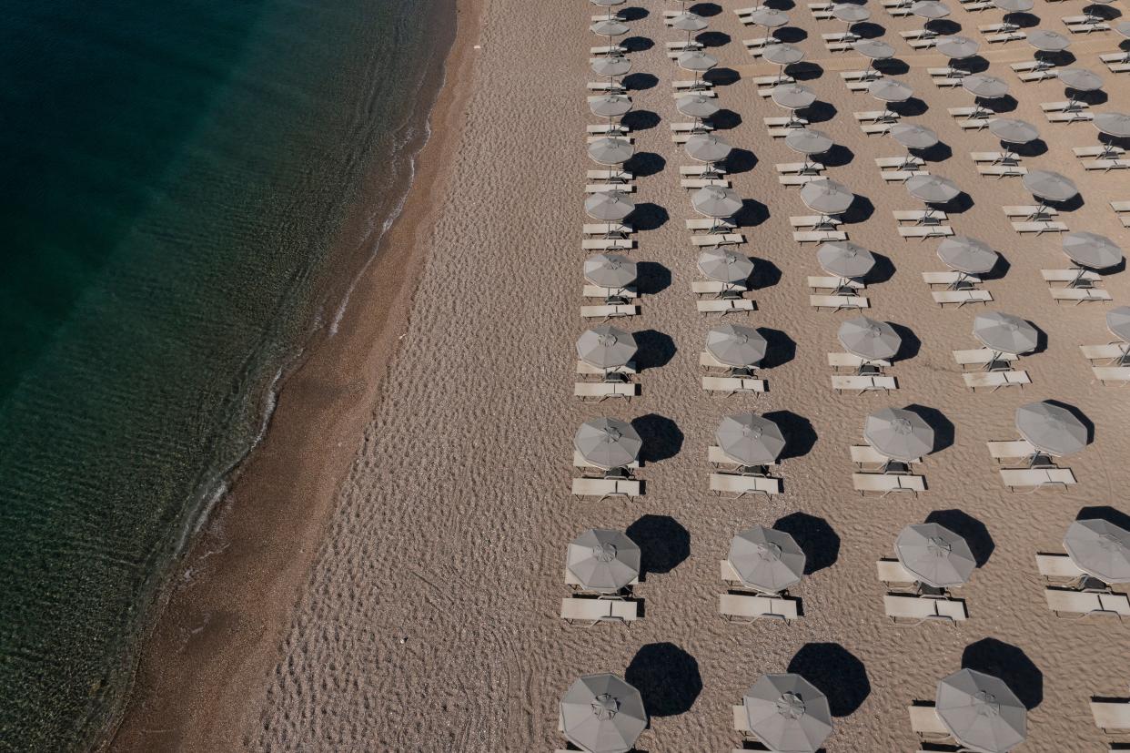 In an aerial view, empty sun loungers line the beach at a resort on July 28, 2023 in Gennadi, Rhodes, Greece (Getty Images)