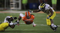 CHAMPAIGN, IL - NOVEMBER 12: Nathan Scheelhaase #2 of the Illinois Fighting Illini is upended by Thomas Gordon #30 of the Michigan Wolverines as Jibreel Black #55 closes in at Memorial Stadium on November 12, 2011 in Champaign, Illinois. Michigan defeated Illinois 31-14. (Photo by Jonathan Daniel/Getty Images)