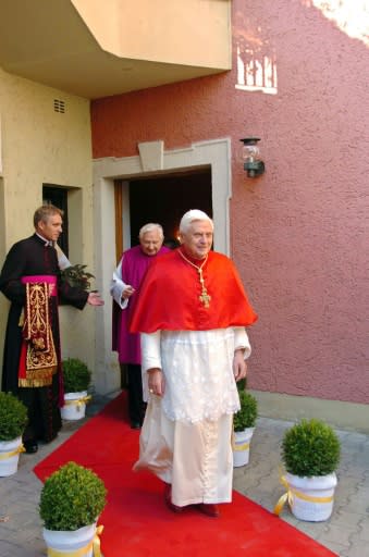 German Archbishop Georg Gaenswein (L) is seen occupying a crucial role for ex-pope Joseph Ratzinger (R)