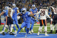 Detroit Lions running back David Montgomery (5) runs in the endzone after his 1-yard rushing touchdown during the second half of an NFL football game against the Chicago Bears, Sunday, Nov. 19, 2023, in Detroit. (AP Photo/Paul Sancya)