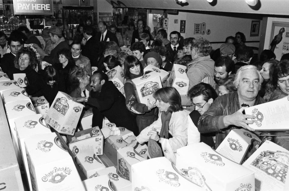 Busy store with parents and children purchasing Cabbage Patch Kids dolls