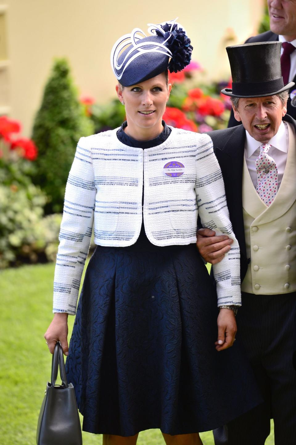 <p>The royal turned up to the 2015 racecourse in a patterned navy dress and chic cream jacket.<br><i>[Photo: PA]</i> </p>