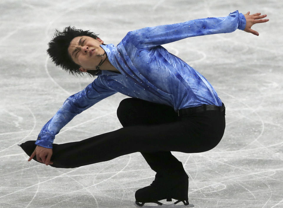 Yuzuru Hanyu of Japan performs during a men's short program of the World Figure Skating Championships in Saitama, near Tokyo, Wednesday, March 26, 2014. (AP Photo/Koji Sasahara)