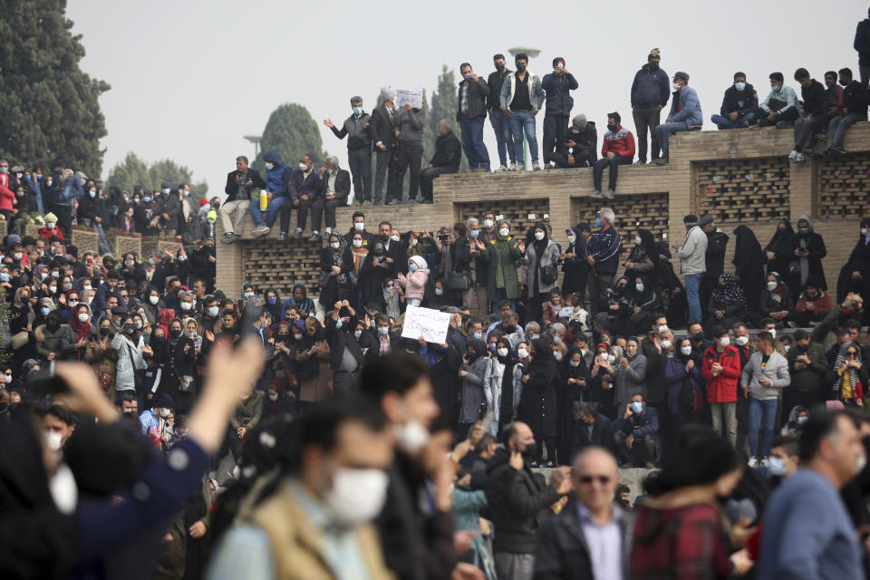 In this photo released by the semi-official Fars News Agency, farmers attend a protest demanding authorities open a dam to relieve drought-stricken areas of central province of Isfahan, on the dried up riverbed of the Zayandeh Roud river in the city of Isfahan 255 miles (410 kilometers) south of the capital Tehran, Iran, Friday, Nov. 19, 2021. Several prominent actors and athletes joined the peaceful movement, urging the government to intervene to aid famers increasingly suffering from droughts that have worsened over the years. (Hamidreza Nikoomaram/Fars News Agency via AP)