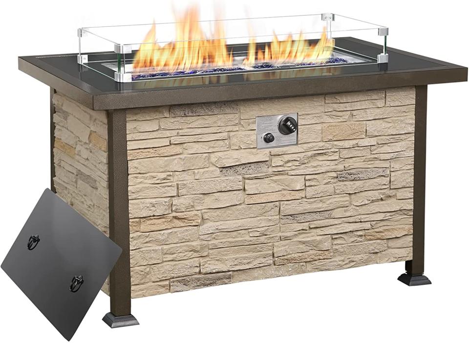 Fire pit table with stone facade