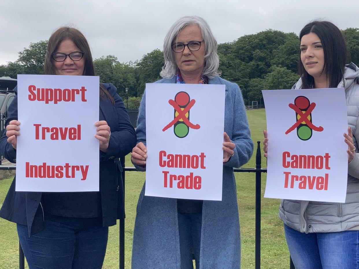 Travel agents take part in a day of action at Parliament Buildings at Stormont in Belfast