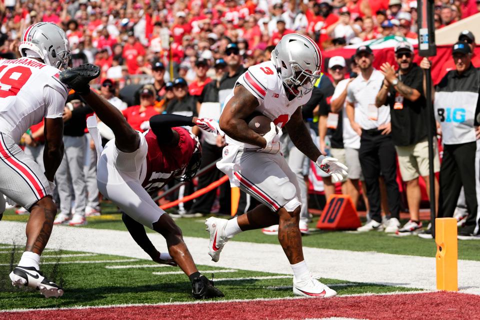 Sep 2, 2023; Bloomington, Indiana, USA; Ohio State Buckeyes running back Miyan Williams (3) runs for a touchdown past Indiana Hoosiers defensive back Josh Sanguinetti (19) during the first half of the NCAA football game at Indiana University Memorial Stadium.