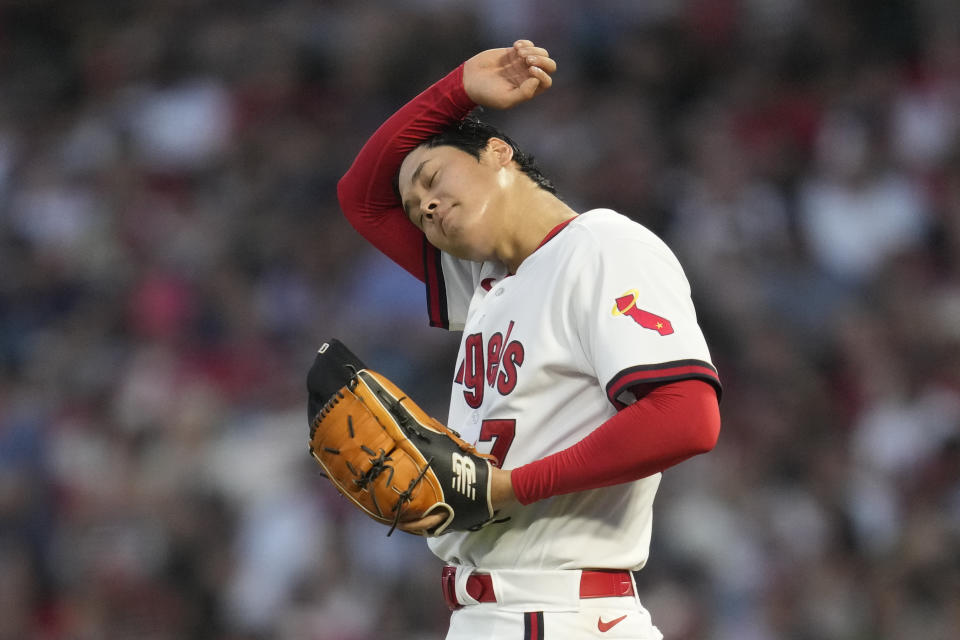 Los Angeles Angels starting pitcher Shohei Ohtani (17) wipes his brow on the mound during the fifth inning of a baseball game against the Pittsburgh Pirates in Anaheim, Calif., Friday, July 21, 2023. (AP Photo/Ashley Landis)