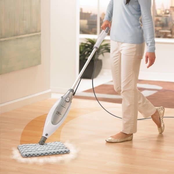 person using the steam mop