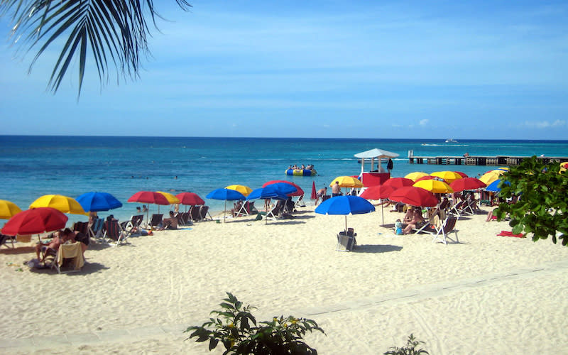 This image shows Doctor’s Cave Bathing Beach at Montego Bay, Jamaica, where a military lockdown was implemented by the island’s government this week. Photo from Getty Images.