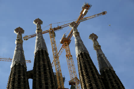 FILE PHOTO: Towers frame construction cranes are seen as work continues on the Basilica Sagrada Familia, which was designed by Antoni Gaudi, November 20, 2015 in Barcelona, Spain. REUTERS/John Schults/File Photo