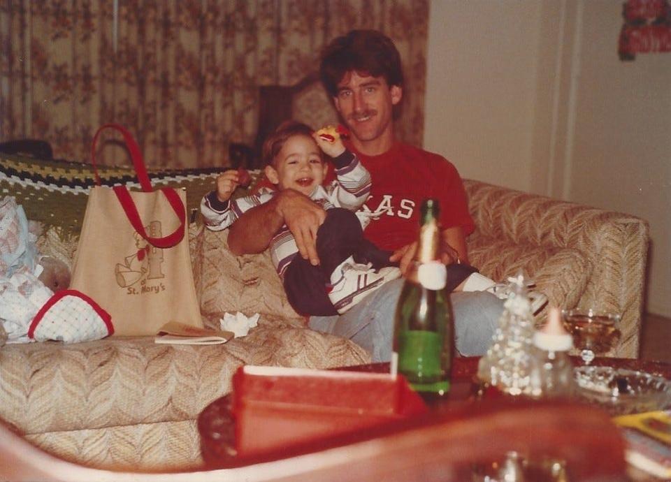 My dad, Mike Jensen, holds my older brother, Anthony. He still rocks the 'stache. My brother, now 36, has gotten a little bit bigger.