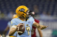 Kent State quarterback Dustin Crum throws during the first half of an NCAA college football game against Northern Illinois, Saturday, Dec. 4, 2021, in Detroit. (AP Photo/Carlos Osorio)