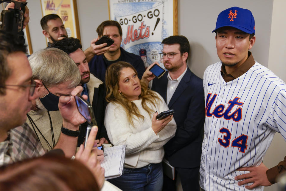 Kodai Senga, right, talks to reporters after a news conference at Citi Field, Monday, Dec. 19, 2022, in New York. The Japanese pitcher and the New York Mets baseball team have finalized a $75 million, five-year contract. (AP Photo/Seth Wenig)