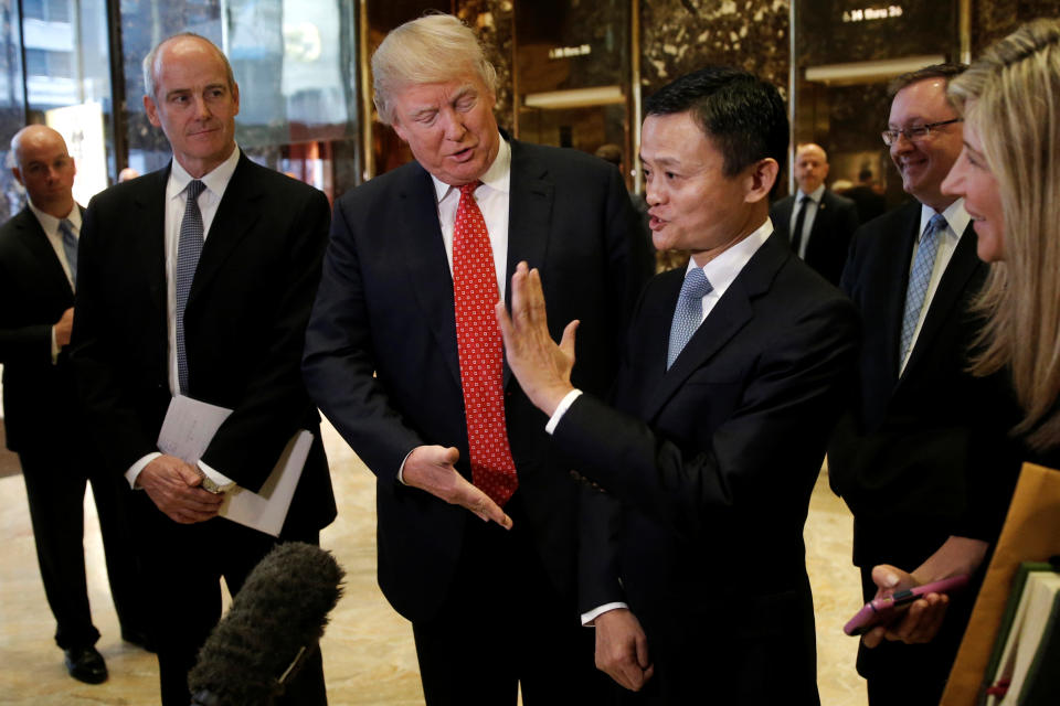 U.S. President-elect Donald Trump and Alibaba Executive Chairman Jack Ma speak with members of the news media after their meeting at Trump Tower in New York, U.S., January 9, 2017.   REUTERS/Mike Segar     TPX IMAGES OF THE DAY